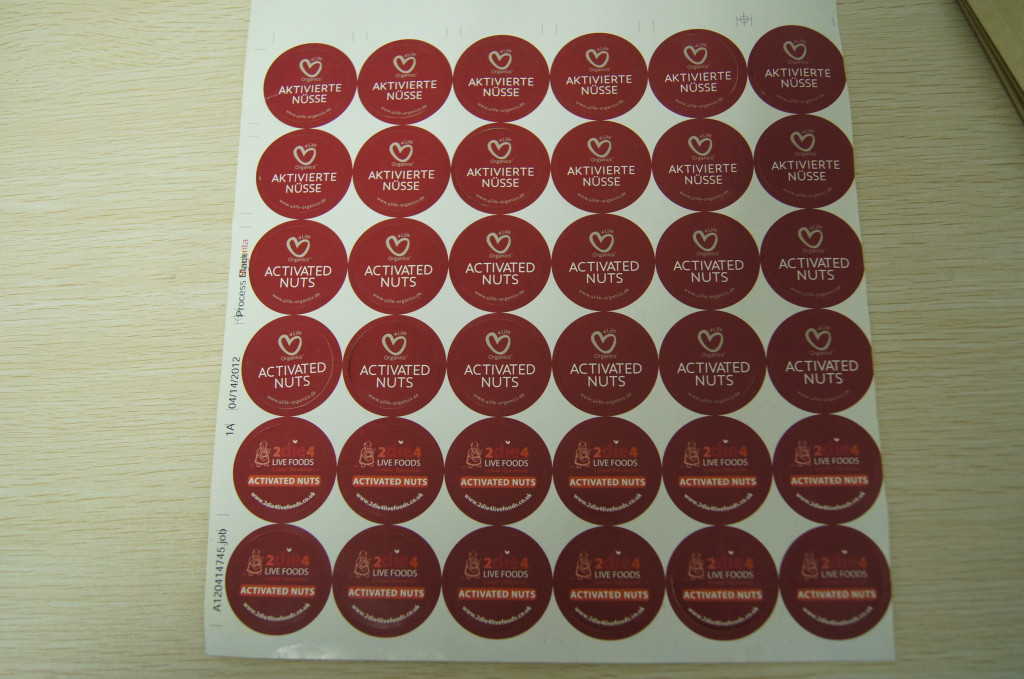 Το στρογγυλό έγγραφο συρρικνώνεται τη συσκευασία μανικιών, συγκολλητικές ετικέτες αυτοκόλλητων ετικεττών για τα ενεργοποιημένα καρύδια