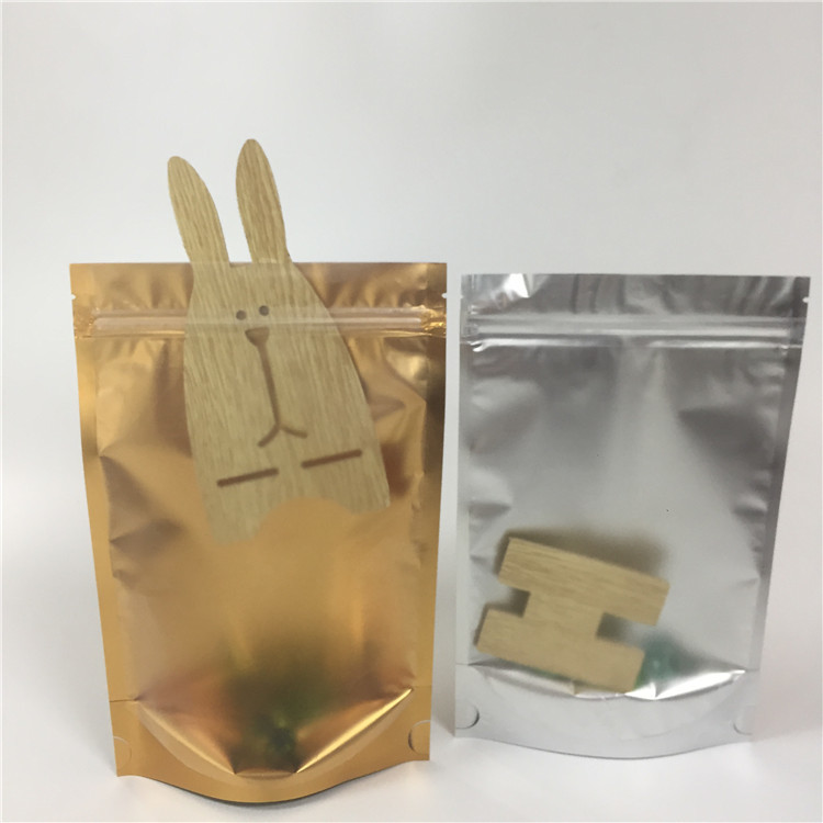 Τοποθετημένη σε στρώματα στάση τσαντών κλειδαριών φερμουάρ φύλλων αλουμινίου αργιλίου επάνω στη διαφανή δευτερεύουσα υγρασία σακουλών - απόδειξη