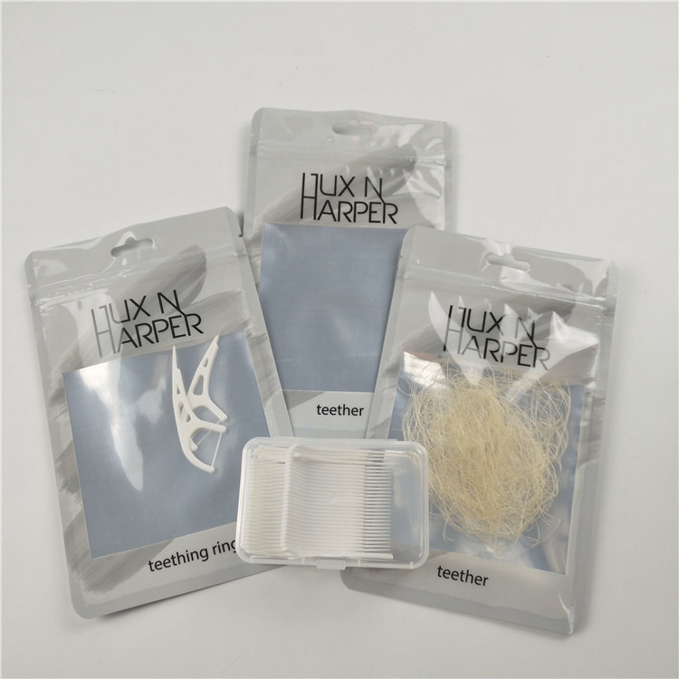 Το στιλπνό σαφές μπροστινό οδοντικό νήμα κρεμά την προσαρμοσμένη συσκευασία τσαντών κλειδαριών φερμουάρ φύλλων αλουμινίου αργιλίου πλαστικών τσαντών τρυπών